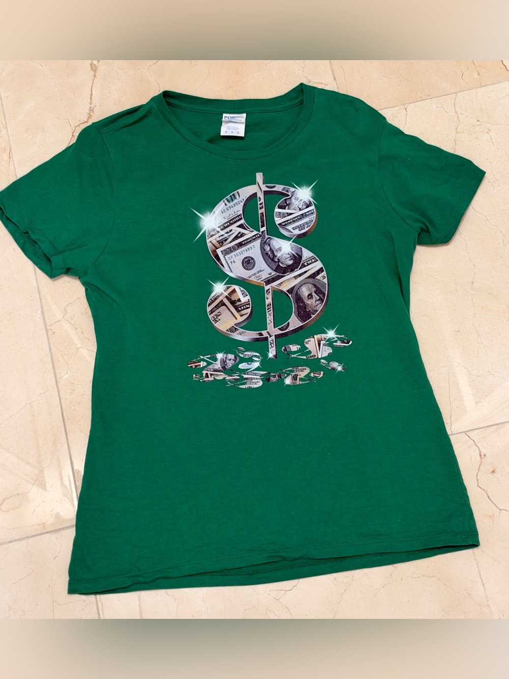 Green dollar sign graphic tee with dollar bills and sparkles